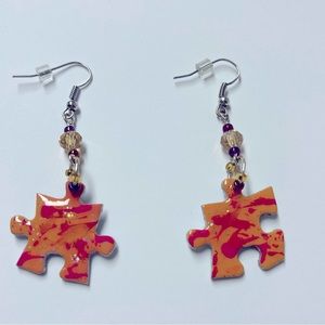Earrings- puzzle piece Handcrafted New. Length 2 1/4”. Sealed. Unique beads